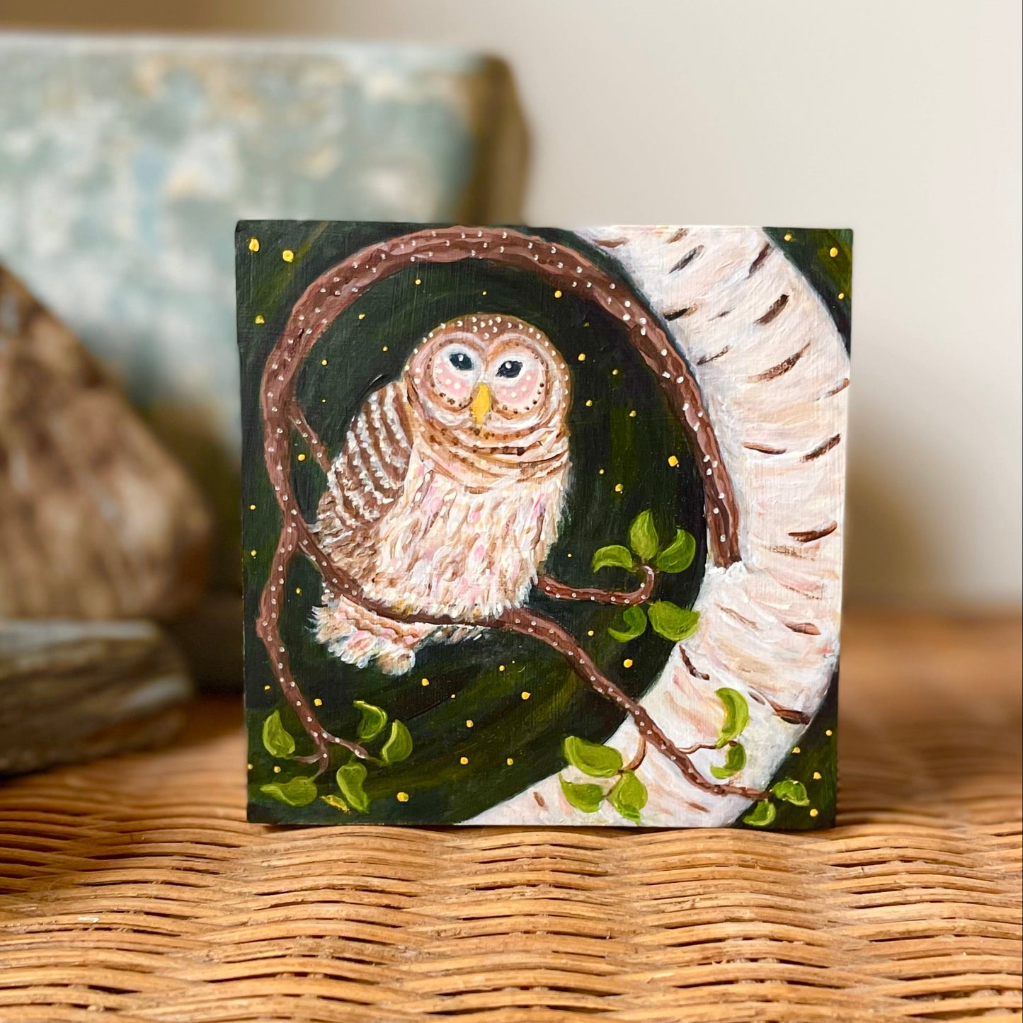 Painting of Barred owl on wavy birch tree branch against night sky