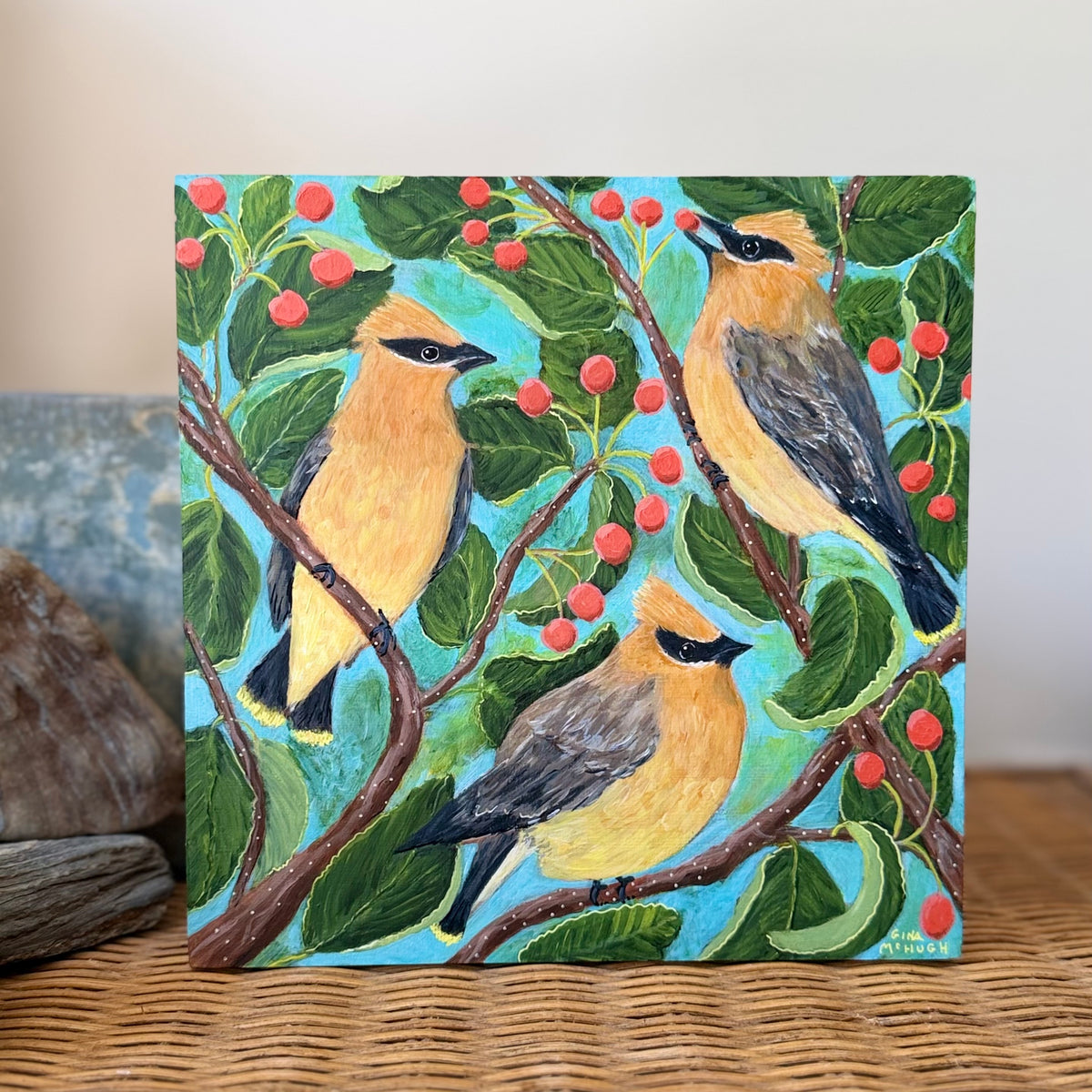 A bright and cheerful Painting of Three cedar waxwing birds among serviceberry branches 