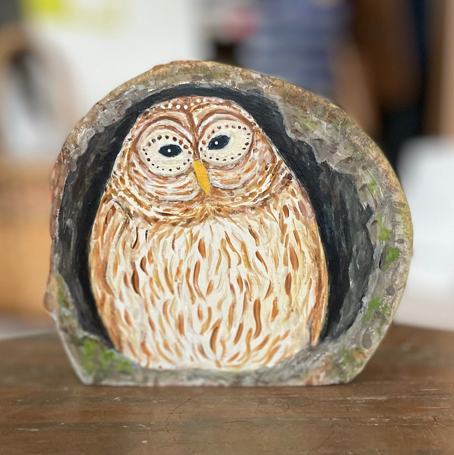 Painting of a Barred owl nesting inside a tree cavity on freestanding aspen wood slice 